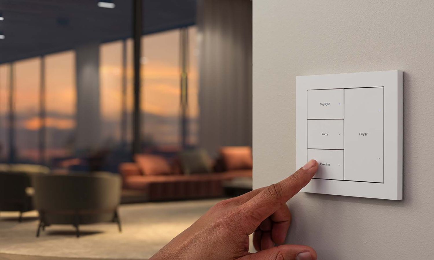 Close up image of a hand pressing on a control4 lux keypad